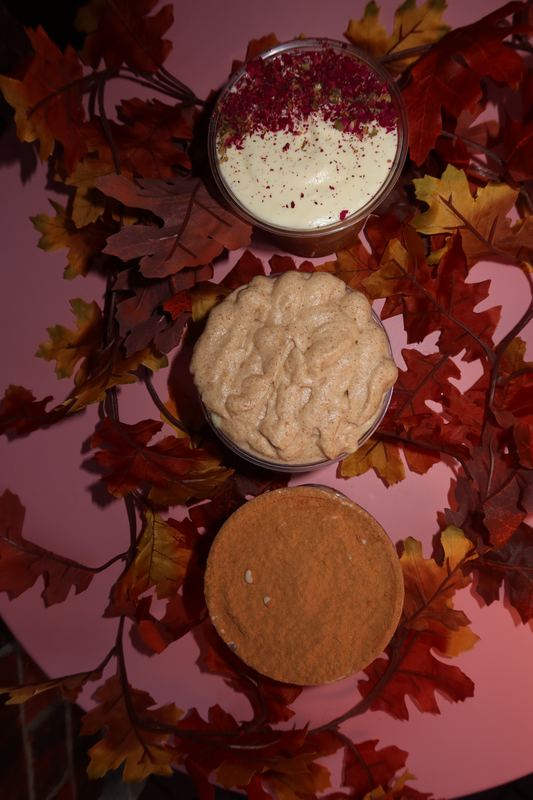 Three drinks from above, showing rose petal, spiced and cinnamon-dusted foam toppings